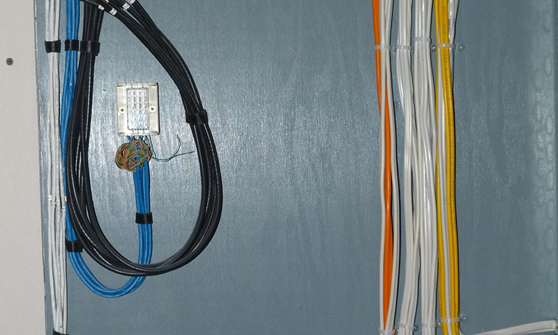 Data-&-Communications Electricians fitting a fusebox